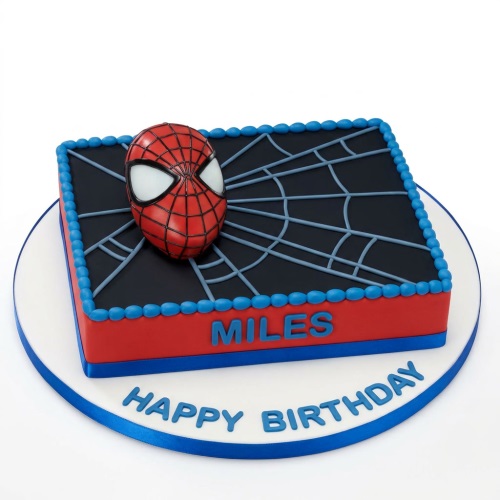 Rectangular Spiderman birthday cake with a 3D mask and spider web design, red, blue, and black colours.