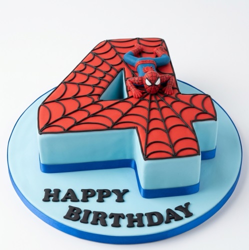 Spiderman themed number cake with red web pattern and Spiderman figurine on top, blue base with 'Happy Birthday' text.