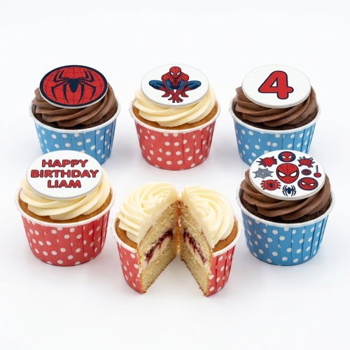 Spiderman themed cupcakes with various superhero toppers, some with custom age and message.