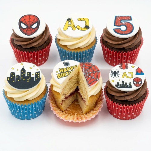 Spiderman themed cupcakes with mask, cityscape, and spiderweb toppers, with custom age and name examples.