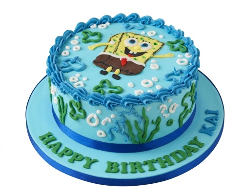 Spongebob Squarepants themed birthday cake with blue ocean frosting, green seaweed, and white bubbles.