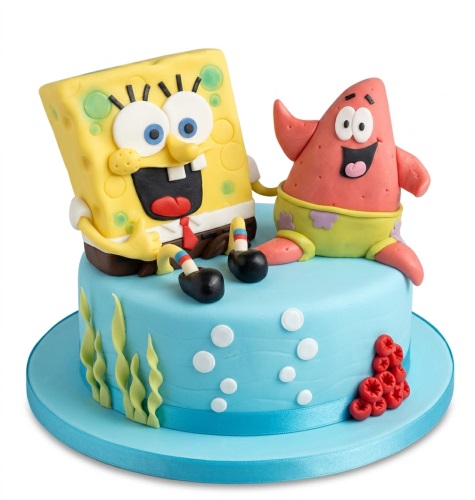 Spongebob Squarepants and Patrick Star birthday cake with blue ocean theme, seaweed, and bubbles.