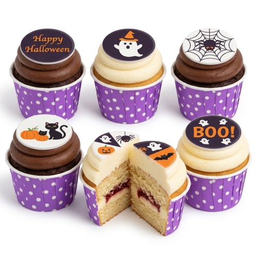 Halloween themed cupcakes with ghost, pumpkin, spider, bat, and black cat toppers on purple polka dot wrappers.
