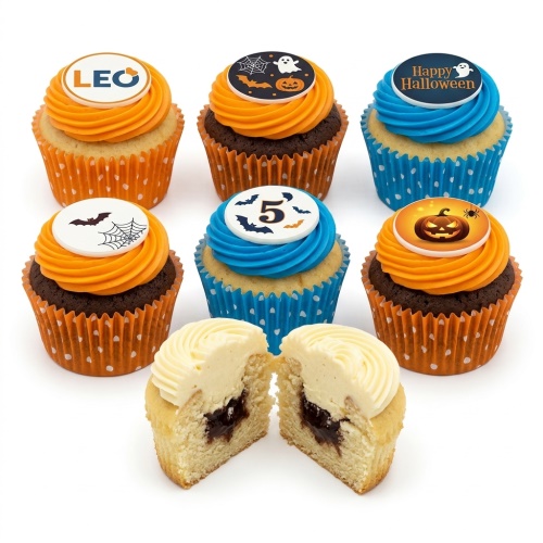 Halloween cupcakes with orange and blue frosting, topped with ghosts, pumpkins, bats, and spiderwebs.