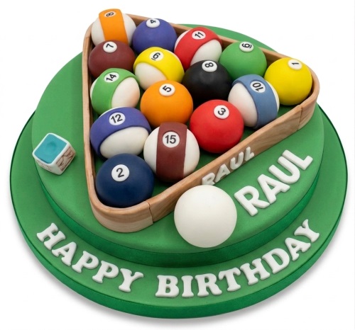 Green two-tier cake decorated as a pool table with edible numbered pool balls, a cue ball, and a chalk cube.