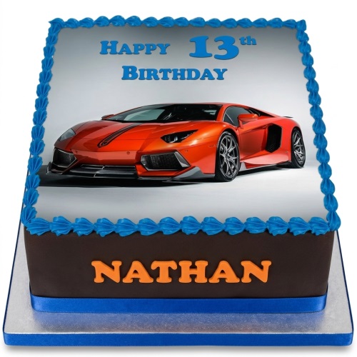 Square birthday cake with an orange sports car photo print, blue icing border, and blue ribbon.