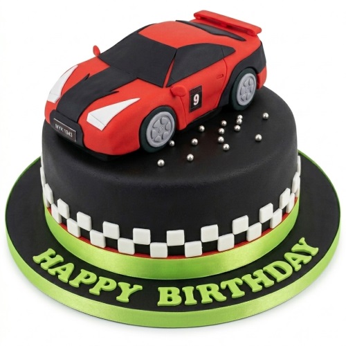 Round black fondant cake with a red and black racing car topper, checkered flag border, and 'Happy Birthday' message.