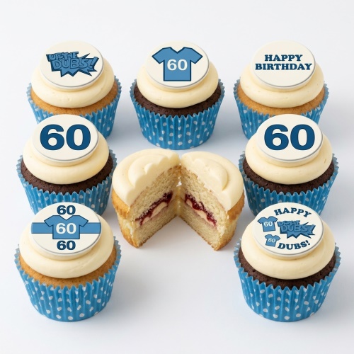 A set of sports theme birthday cupcakes with custom age and jersey toppers, in blue and white cases.