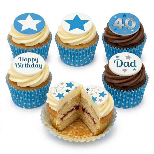 Six cupcakes with blue and white star toppers, one showing 'Happy Birthday', one '40', and one 'Dad'. One cupcake is cut in half revealing jam filling.