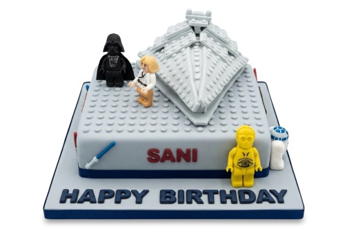 Star Wars Lego theme birthday cake with Darth Vader, Luke Skywalker, C-3PO, R2-D2, and Star Destroyer.