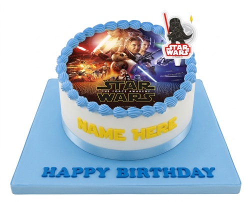 Round white Star Wars The Force Awakens birthday cake with blue icing and Darth Vader topper.
