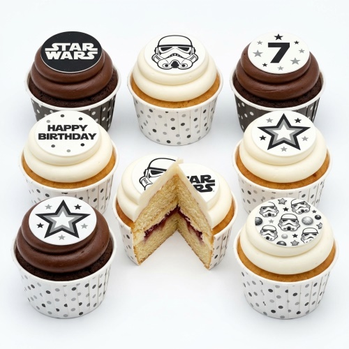 Star Wars themed cupcakes with Stormtrooper helmets, logos, and star toppers.