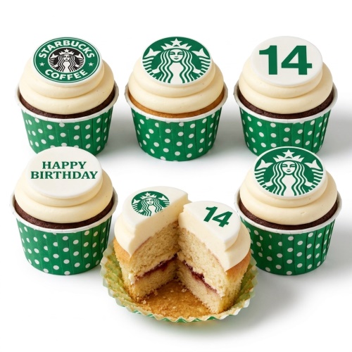 Starbucks themed cupcakes with custom age 14 and Happy Birthday toppers in green polka dot wrappers.