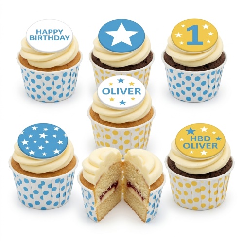 A box of vanilla and chocolate cupcakes with star-themed toppers, some showing 'Happy Birthday', a large white star, a number '1', and custom names.
