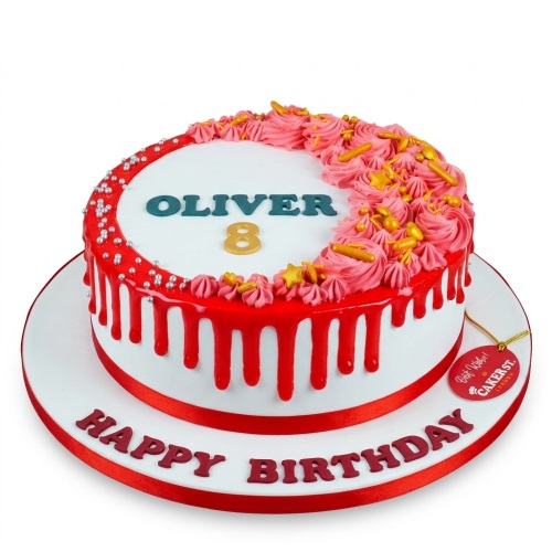 Round white birthday cake with red drip, pink piping, gold and silver sprinkles, and a custom age topper.