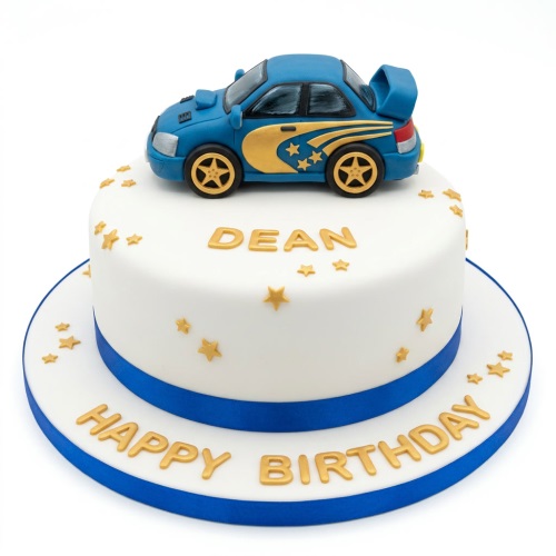 Two-tier white fondant cake with a blue racing car topper, gold stars, and blue ribbon.