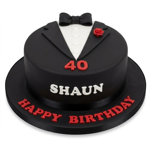 Round black tuxedo suit birthday cake with white shirt, black bow tie, red rose, and custom age.
