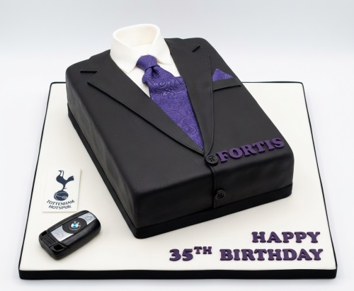 Black suit jacket cake with white shirt, purple tie, and custom birthday message.