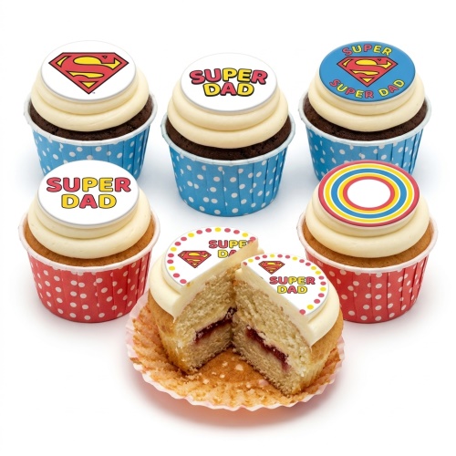 Cupcakes with white frosting, "SUPER DAD" and Superman logo toppers, in red and blue polka dot cases.