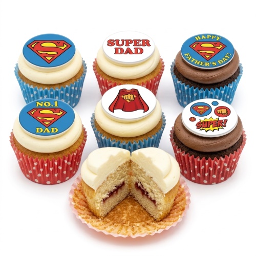 A set of Superman themed cupcakes with red and blue wrappers and various edible superhero toppers for dads.