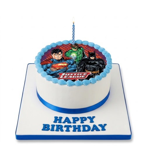 Round white Justice League birthday cake with Superman, Batman, and Green Lantern edible image, blue ribbon, and "Happy Birthday" text.