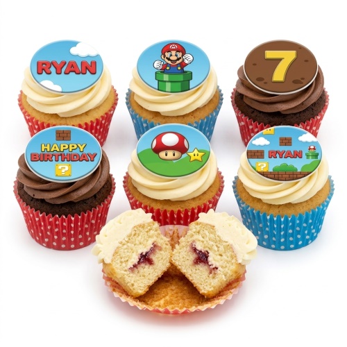 Six Super Mario themed cupcakes with edible toppers, some with vanilla frosting, some chocolate, in red and blue polka dot cases.