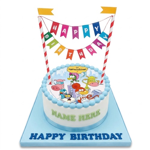 Round white cake with Los Superminiheroes edible image, blue beads, personalised name, and Happy Birthday banner.