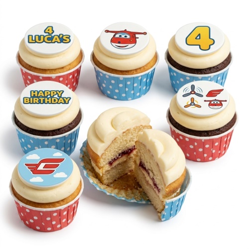 A collection of Super Wings themed cupcakes with white frosting, red and blue polka dot cases, featuring Jett, Super Wings logo, propellers, and custom age/message toppers.
