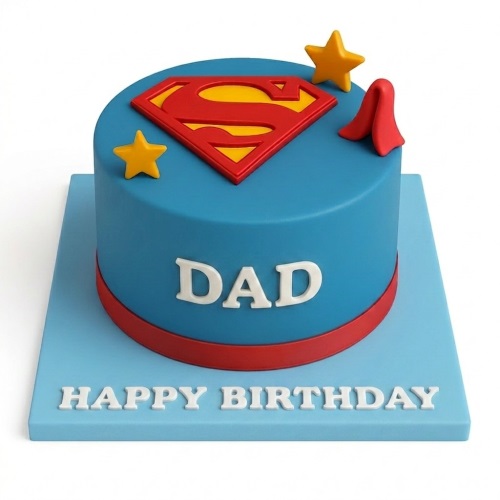 Blue round Superman birthday cake with red 'S' logo, yellow stars, and custom message.