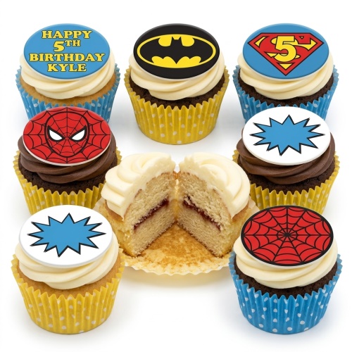 Assortment of superhero themed cupcakes with Batman, Superman, Spiderman, and comic burst toppers on vanilla and chocolate cupcakes.