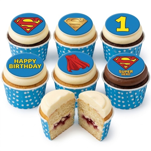 Superman themed cupcakes with red and yellow logos, a cape, and 'Happy Birthday' text.