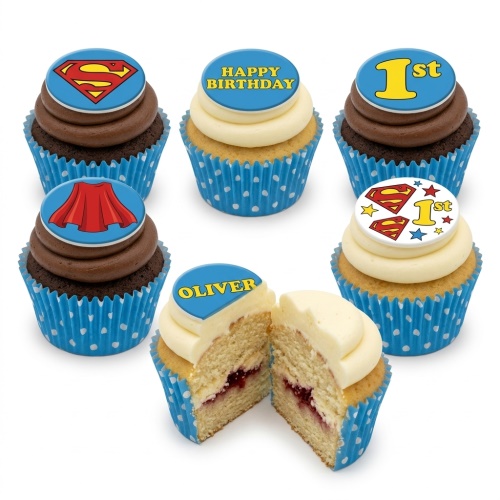 Superman themed cupcakes with custom age and message toppers, in blue polka dot cases.
