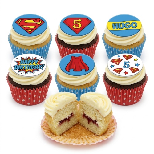 Superman themed birthday cupcakes with red and blue toppers, featuring logo, cape, and custom age.