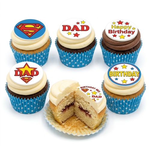 Set of Superman and 'DAD' themed birthday cupcakes with blue polka dot cases.