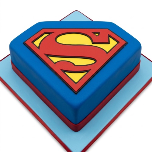 Blue diamond-shaped Superman logo birthday cake with red and yellow 'S' shield.