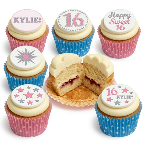 Vanilla cupcakes with cream frosting, pink and blue polka dot cases, and edible star-themed toppers with custom age and name.