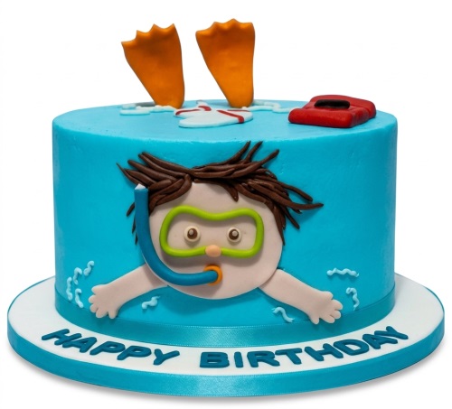 Round blue cake with cartoon boy in snorkel, orange flippers, and red float.