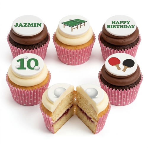 Cupcakes with table tennis theme toppers, ping pong bats, balls, table, and custom age.