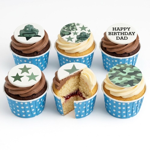 Cupcakes with green tank, camouflage, and star toppers on chocolate and vanilla frosting in blue polka dot cases.