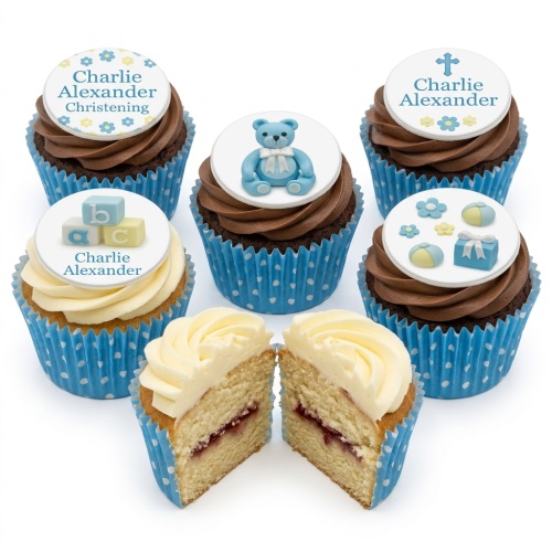 Baby boy Christening cupcakes with blue teddy bear, blocks, cross, and gift toppers.