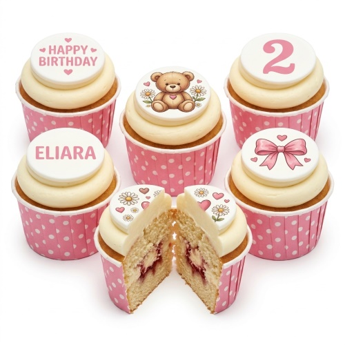 Six teddy bear themed birthday cupcakes with pink polka dot wrappers, custom age topper, and personalised name.