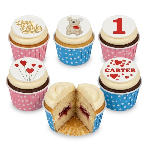 Assortment of kids birthday cupcakes with teddy bear, hearts, and customisable age and name toppers.