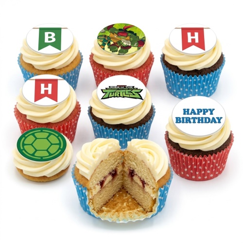 Set of Teenage Mutant Ninja Turtles themed cupcakes with character, logo, and turtle shell toppers, plus initial flags and a 'Happy Birthday' message.
