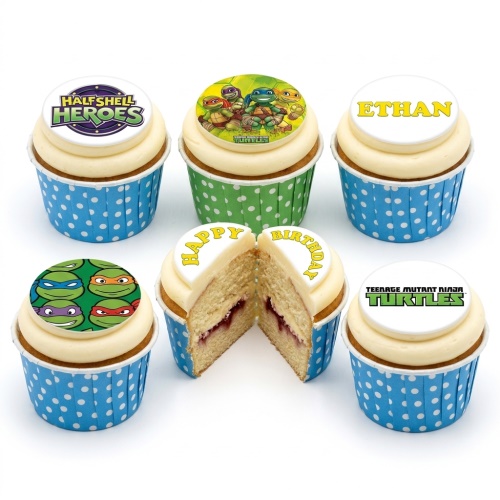 Teenage Mutant Ninja Turtles themed cupcakes with character toppers and a 'Happy Birthday' message.