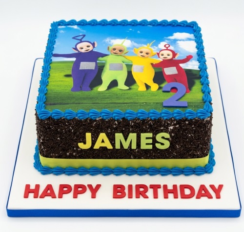 Square Teletubbies birthday cake with edible image, chocolate sprinkles, and custom age topper.