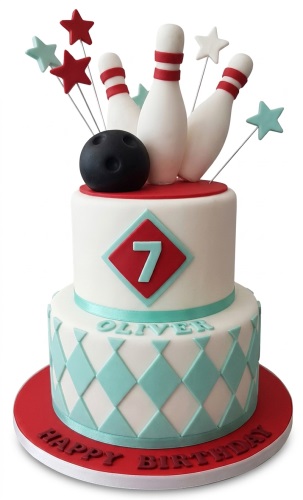 Two-tier white bowling themed birthday cake with red and teal accents, bowling pins, ball, stars, custom age number 7, and personalised name Oliver.