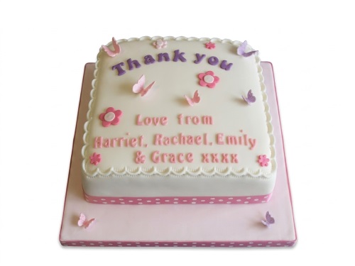 White square cake with pink and purple butterflies, flowers, and a custom thank you message.