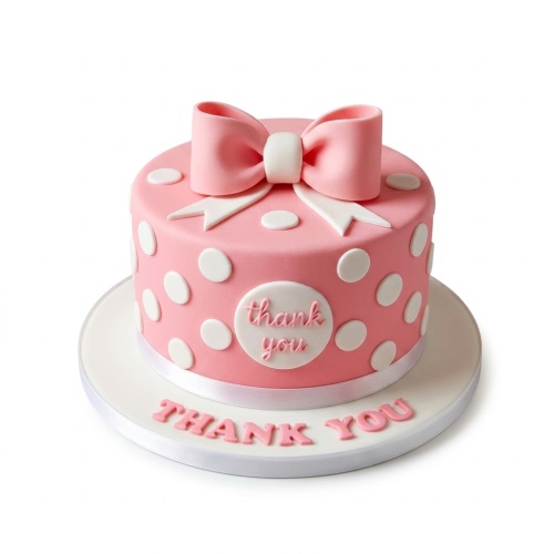 Pink polka dot cake with a large pink bow and a 'Thank You' message on the side and cake board.