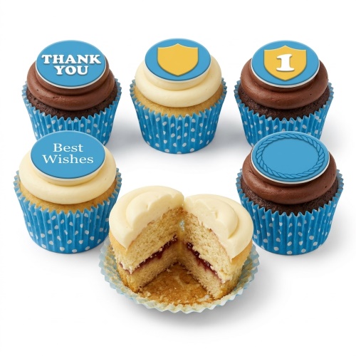Six cupcakes with blue polka dot wrappers, some with chocolate frosting and some with vanilla. Toppers include 'THANK YOU', 'Best Wishes', a yellow shield, a yellow shield with '1', and a blank blue topper with a braided border.