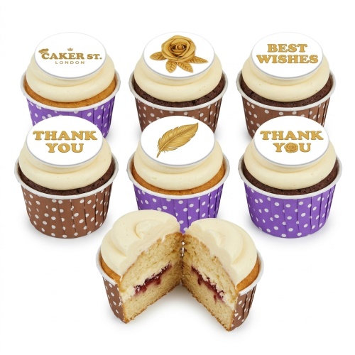Six cupcakes with white frosting and gold edible toppers. Designs include a rose, feather, 'BEST WISHES', 'THANK YOU', and a brand logo. One cupcake is cut to show jam filling.